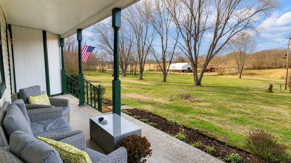 Covered front porch overlooking the acreage at 2877 Bryant Road